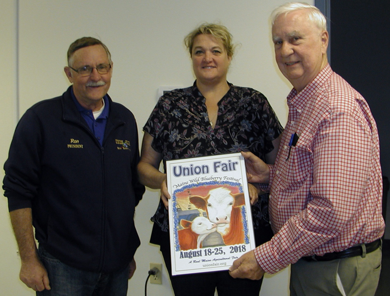 From left: Union Fair/Maine Wild Blueberry Festival President Ron Hawes, 2018 Union Fair poster contest winner Gail Hawes, and poster contest chair George Gross display the 2018 Union Fair poster (Photo courtesy Union Fair)