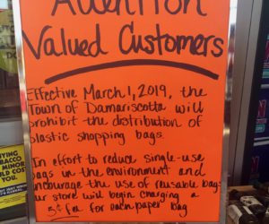 A sign at Hannaford Supermarket in Damariscotta informs customers that the town's ban on plastic bags will take effect Friday, March 1, and says the store will charge 5 cents per paper bag. (Jessica Picard photo)