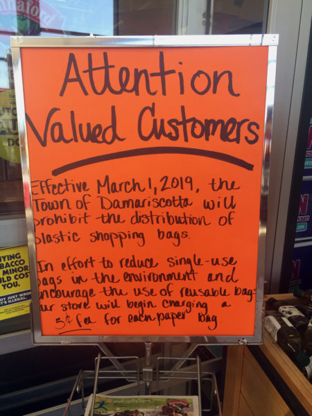 A sign at Hannaford Supermarket in Damariscotta informs customers that the town's ban on plastic bags will take effect Friday, March 1, and says the store will charge 5 cents per paper bag. (Jessica Picard photo)
