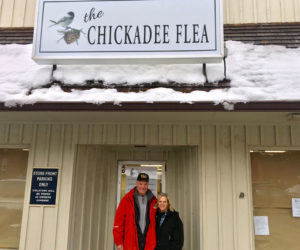 Paul and Trish L'Heureux stand in front of the door to their soon-to-open shop, The Chickadee Flea, at the Elm Street Plaza in downtown Damariscotta. The couple plans to open the shop in early spring. (Suzi Thayer photo)