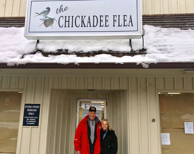 Paul and Trish L'Heureux stand in front of the door to their soon-to-open shop, The Chickadee Flea, at the Elm Street Plaza in downtown Damariscotta. The couple plans to open the shop in early spring. (Suzi Thayer photo)