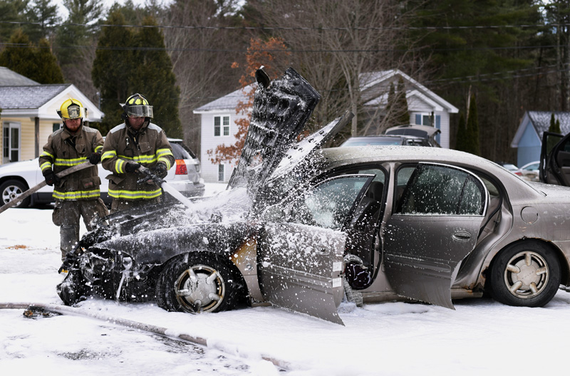 Damariscotta firefighters douse a car fire in the driveway of 4 Pond Circle, off Lessner Road, Thursday, Feb. 7. (Jessica Picard photo)