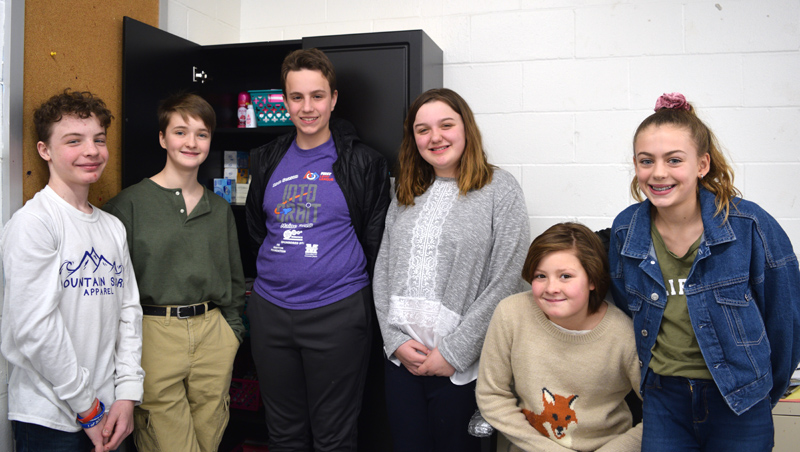 Members of the Great Salt Bay Community School Student Council stand around the "comfort closet," their effort to provide hygiene items and snacks to students in need. From left: Joseph Krawic, Ava Nery, Connor Parson, Olivia Swartzentruber, Lydia Branson, and Mariana Janik. Members absent from the photo are Aiden Jacobs, Liam Card, Michaela LaCrosse, and Aleshia Alicea. (Jessica Clifford photo)