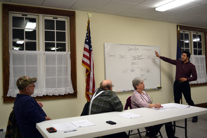 From left: Third Selectman Allan Moeller, Second Selectman Dwight Keene, and First Selectman Trudy Foss listen as Administrative Assistant Michael Henderson explains the current structure of the town office during a public hearing at Pownalborough Hall on Monday, Feb. 25. (Jessica Clifford photo)