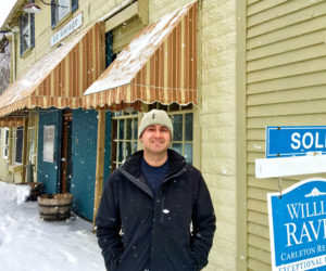 Ed Colburn stands in front of his new restaurant, the former Le Garage, at 15 Water St. in Wiscasset. He plans to reopen the restaurant in the spring. (Suzi Thayer photo)