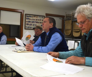 Lincoln County Sheriff Todd Brackett (far left) speaks during a public hearing at the Alna fire station Tuesday, March 12 as, from left, Alna Fire Chief Michael Trask, Lincoln County Sheriff's Office Chief Deputy Rand Maker, and Alna resident Chris Kenoyer listen. (Jessica Clifford photo)
