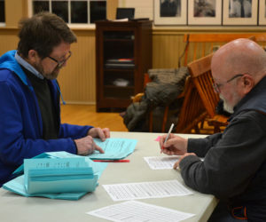 Alden Sproul (left) and Kenneth Frederic count ballots cast in the Bristol election the evening of Monday, March 18. (Maia Zewert photo)