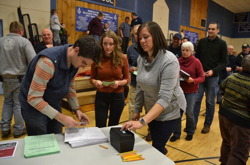 Bristol residents vote on the school budget during the annual town meeting at Bristol Consolidated School on Tuesday, March 19. (Maia Zewert photo)