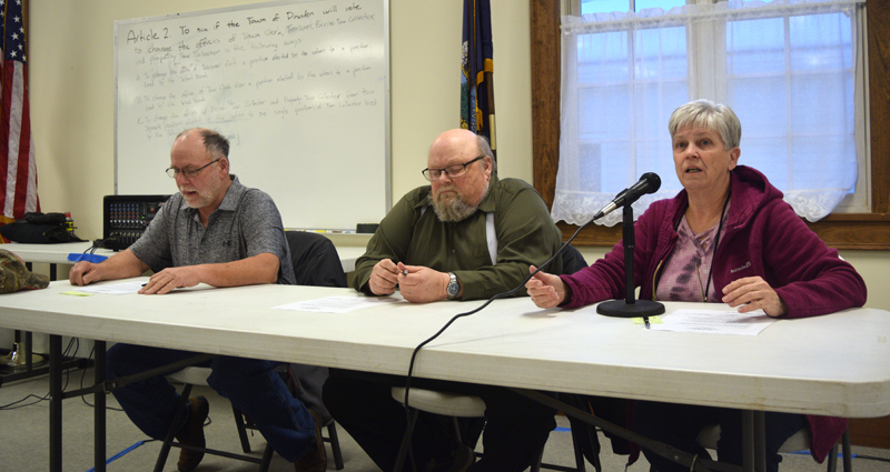 Dresden First Selectman Trudy Foss (right) responds to a resident's comment during a special town meeting at Pownalborough Hall on Monday, March 11 as Third Selectman Allan Moeller (left) and Second Selectman Dwight Keene look on. (Jessica Clifford photo)