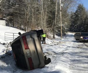 A 2001 Honda Odyssey rests on its side after a single-vehicle accident on East Pond Road in Nobleboro the morning of Sunday, March 3. There were no injuries, according to the Lincoln County Sheriff's Office.