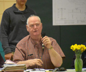 Nobleboro Board of Selectmen Chair Dick Spear talks about increases in the town budget during town meeting at Nobleboro Central School on Saturday, March 16. (Alexander Violo photo)
