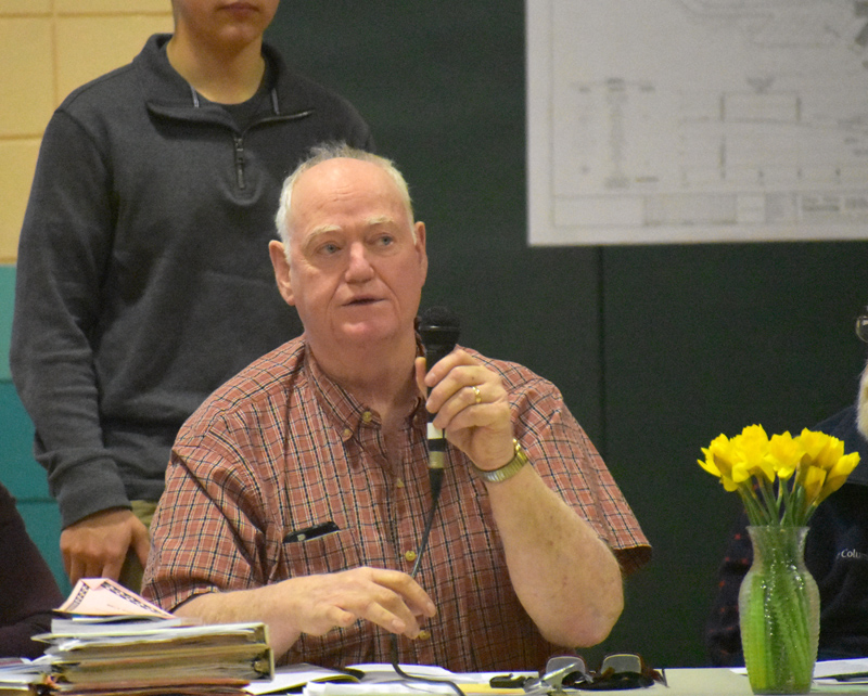 Nobleboro Board of Selectmen Chair Dick Spear talks about increases in the town budget during town meeting at Nobleboro Central School on Saturday, March 16. (Alexander Violo photo)