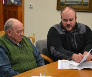 Maine Department of Transportation Project Manager Jason Stetson (right) speaks with South Bristol Harbor Master Cecil Burnham during the South Bristol Board of Selectmen's meeting Thursday, March 14. (Maia Zewert photo)