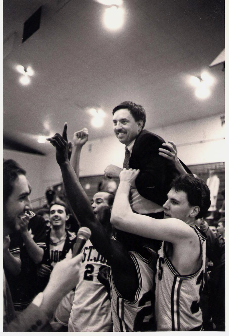 Rick Simonds' players lift him onto their shoulders after a 75-74 win over Castleton State College to take the National Association of Intercollegiate Athletics' 1986-1987 New England championship and secure a berth in the national tournament. (Photo courtesy St. Joseph's College Athletics)