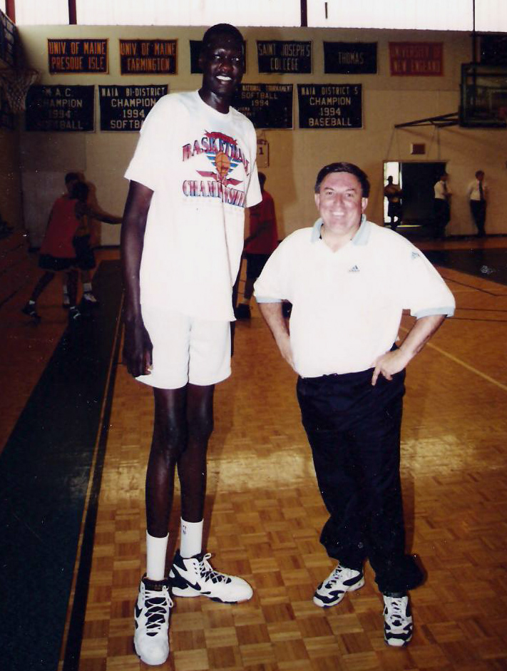 Rick Simonds (right) with Manute Bol at St. Joseph's College in 1996, when Simonds was the assistant coach of the Portland Mountain Cats in the U.S. Basketball League. A The 7-foot-7-inch former NBA blocks leader spent the preseason with the Mountain Cats, who would often practice at St. Joseph's. (Photo courtesy St. Joseph's College Athletics)