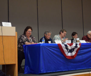 From left: Moderator Jeffrey Frankel concludes Whitefield's annual town meeting as Administrative Assistant Darlene Beaulieu and Selectmen Tony Marple, Lester Sheaffer, Charlene Donahue, Bill McKeen, and Frank Ober look on. (Jessica Clifford photo)