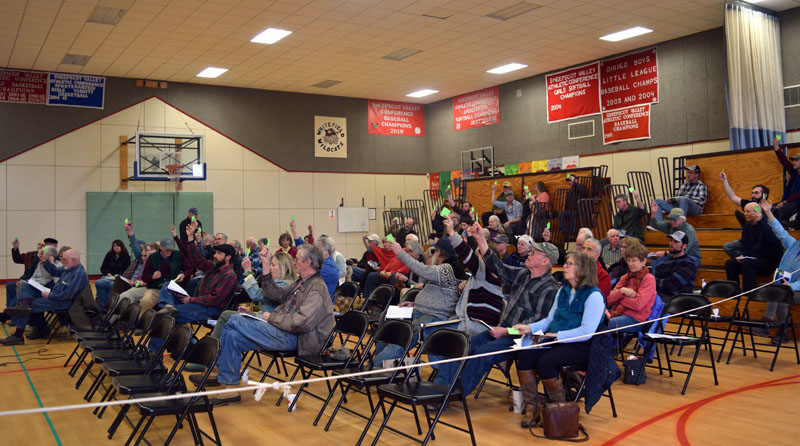 After much debate, a majority of Whitefield residents vote in support of a local food sovereignty ordinance during annual town meeting in the Whitefield Elementary School gym Saturday, March 16. (Jessica Clifford photo)