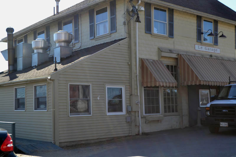 An architect for the new owner of the former Le Garage aims to conceal condensing units on the lower roof of the building's Main Street side. The Wiscasset Historic Preservation Commission is reviewing an application for these and other changes to the building's exterior. (Charlotte Boynton photo)