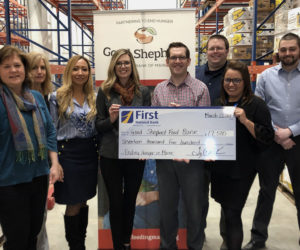 First National Bank presents Good Shepherd Food Bank with a check for $17,500.