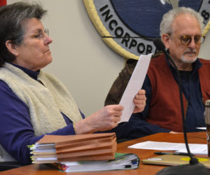 Damariscotta Board of Selectmen Chair Robin Mayer reads from her notes on marijuana ordinances as Selectman Ronn Orenstein looks on during a workshop at the town office Wednesday, March 27. (Maia Zewert photo)