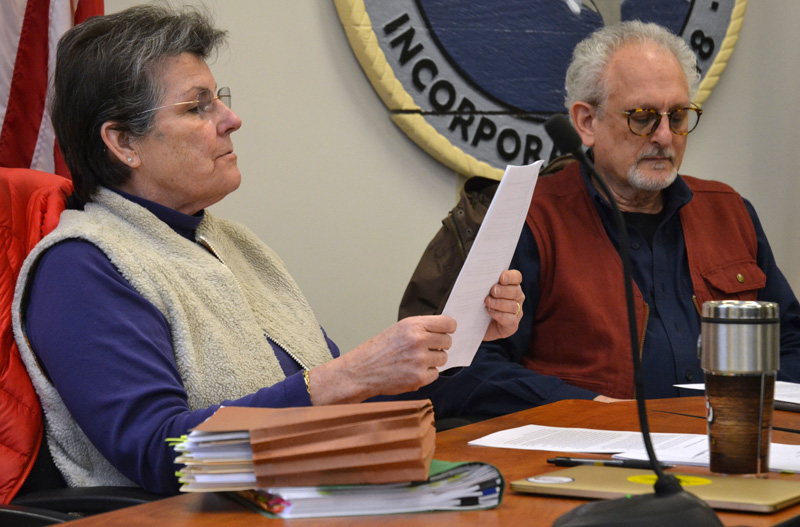 Damariscotta Board of Selectmen Chair Robin Mayer reads from her notes on marijuana ordinances as Selectman Ronn Orenstein looks on during a workshop at the town office Wednesday, March 27. (Maia Zewert photo)