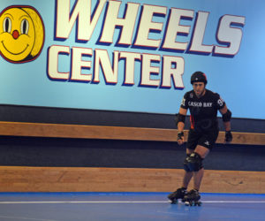 Michael "Hurry Kaine" Henderson skates for Casco Bay Roller Derby during a home game at Happy Wheels Skate Center in Portland on April 6. Henderson is the administrative assistant for the town of Dresden and a "jammer" on the roller derby track. (Jessica Clifford photo)