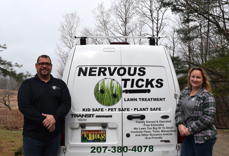 Eric and Heather Brewer, of Edgecomb, stand alongside the van for their new business, Nervous Ticks. The business offers organic lawn treatment to control ticks and other pests. (Jessica Clifford photo)