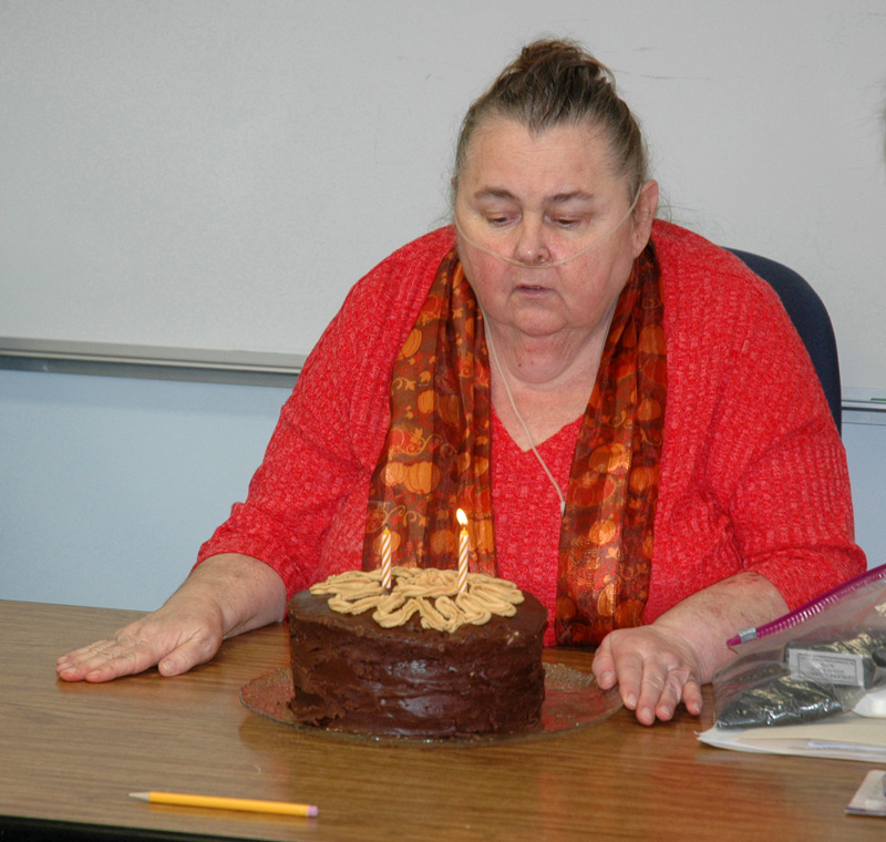 Somerville Third Selectman Darlene Landry blows out the candles on her birthday cake at the end of a selectmen's meeting Nov. 1, 2017. Landry resigned from the board effective April 1. (Alexander Violo photo, LCN file)