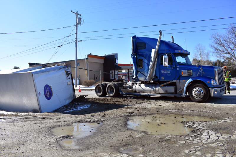 There were no injuries when the trailer of a tractor-trailer detached and rolled onto its side on Winslows Mills Road in Waldoboro, near Route 1, the morning of Thursday, April 11. (Alexander Violo photo)