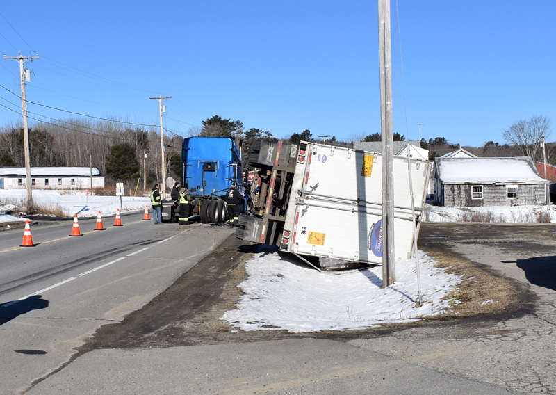 The trailer of a tractor-trailer lies on its side in a ditch on Route 32 in Waldoboro the morning of Thursday, April 11. A mechanical issue caused the trailer to detach, according to police. (Alexander Violo photo)