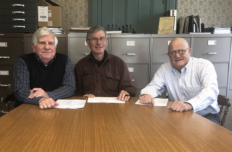 From left: Dick McLean, treasurer of Lincoln County Dental Inc.; Les Fossel, board member; and Dr. Jim Olson, president, attend the closing on the nonprofit's future clinic at attorney Rob Gregory's office in Damariscotta on Monday, April 15. (Photo courtesy Holly Stover)
