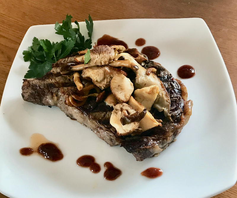 Marilyn marinated her steaks, grilled them to medium-rare, and served them with mushrooms, sauteed in butter, and some famous Peter Luger Steakhouse sauce. (Photo courtesy Marilyn Gorneau)