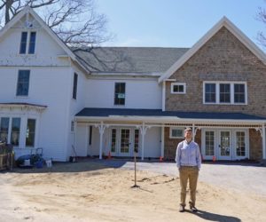 Coastal Rivers Conservation Trust Executive Director Steven Hufnagel stands in front of the newly renovated Rafter family farmhouse, the trust's new headquarters at Round Top Farm in Damariscotta. (Evan Houk photo)