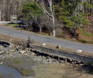 A view of Miles Street in Damariscotta from the parking lot at LincolnHealth's Miles Campus. The town of Damariscotta and LincolnHealth will split the cost to rebuild the street, build a new sidewalk, and rebuild the retaining wall. (Evan Houk photo)