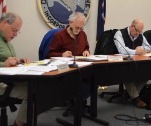 From left: Damariscotta Town Manager Matt Lutkus and Selectmen Ronn Orenstein, Mark Hagar, and Amy Leshure review draft marijuana ordinances. The selectmen voted 3-1 to approve the ordinances and bring them to public hearings in August. (Evan Houk photo)