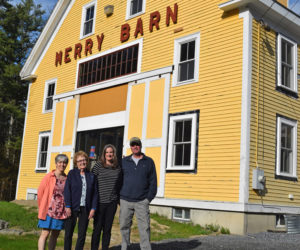 From left: Heather Webster, Ruth Davison, Stephanie McSherry, and Laroy Ellinwood outside Merry Barn. Webster and Davison are the daughter and widow of Howie Davison, who ran a dance hall in the barn; McSherry is the current owner of the barn; and Ellinwood's parents owned the barn before the Davisons. (Jessica Clifford photo)