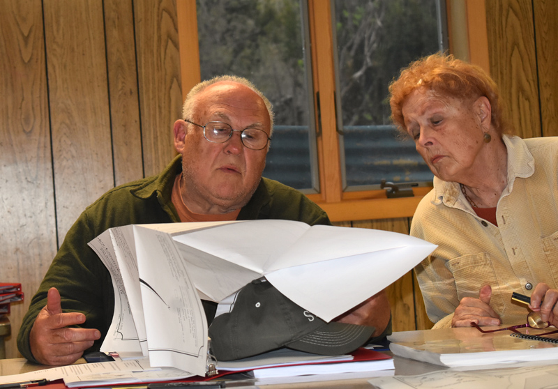 Edgecomb Planning Board Chair Barry Hathorne and Vice Chair Pat Jeremiah review documents from Cook's Landing Bar and Grille on Thursday, May 16. (Alexander Violo photo)