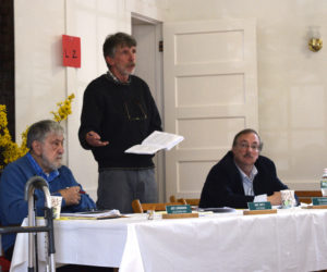 Edgecomb Selectman Mike Smith speaks during annual town meeting Saturday, May 18 while Selectmen Jack Sarmanian (left) and Ted Hugger look on. (Jessica Clifford photo)