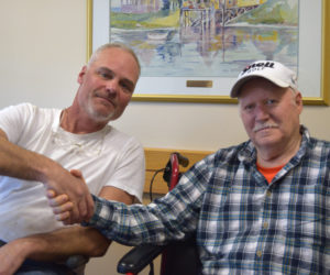 From left: David Reiss shakes hands with David Drever weeks after rescuing Drever from the cold waters of Damariscotta Lake on April 22. (Jessica Clifford photo)