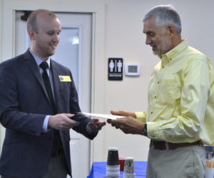From left: Scott Wilkinson, regional representative for U.S. Sen. Angus King, presents a certificate of recognition to Lincoln County Planner Bob Faunce during Faunce's retirement party at the Lincoln County Regional Planning Commission in Wiscasset on May 15. (Charlotte Boynton photo)