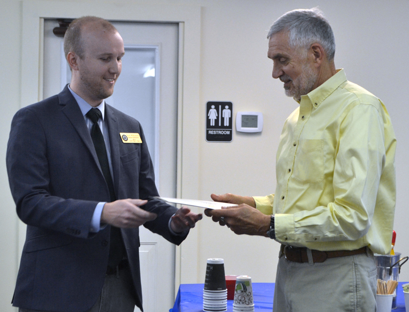 From left: Scott Wilkinson, regional representative for U.S. Sen. Angus King, presents a certificate of recognition to Lincoln County Planner Bob Faunce during Faunce's retirement party at the Lincoln County Regional Planning Commission in Wiscasset on May 15. (Charlotte Boynton photo)