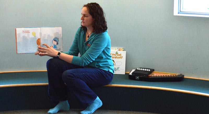 Jessie Trafton, children's librarian at Skidompha Library, reads to toddlers during her children's story time at the library Tuesday, April 30. Trafton will host "Reading is Magic," a new program on Lincoln County Television. (Evan Houk photo)