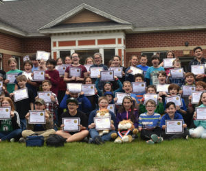 Miller School fifth graders pose with Waldoboro Police Chief John Lash (far left) and Officer Nathaniel Jack (far right) after their completion of a 10-week D.A.R.E. class. (Alexander Violo photo)