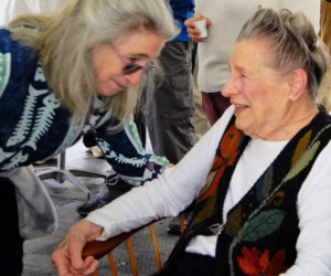 Jerry Day Mason (right) shares a moment with her daughter, Jody Brown, of Wiscasset, during Mason's 100th birthday party at her Westport Island home May 4. (Photo courtesy Gaye Wagner)