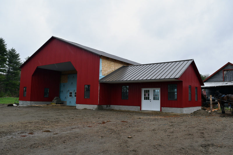 The exterior of Whitefield Metal Sales, a new manufacturer of metal roofing and other products at 69 Mills Road in Whitefield. Work on the building's siding is ongoing. (Jessica Clifford photo)