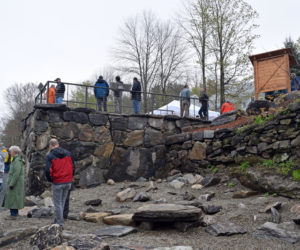 Visitors explore the former Coopers Mills Dam site after the dedication Monday, May 20. The base of the overlook incorporates stone from the dam. (Jessica Clifford photo)