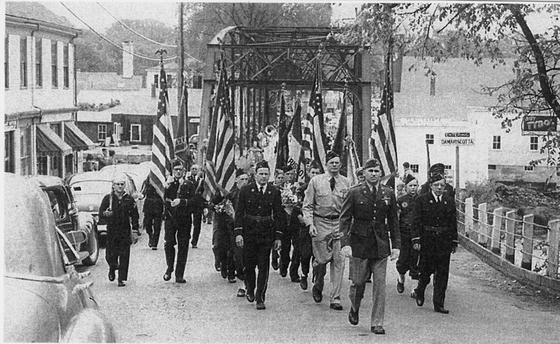 A Memorial Day parade crossing the street from Damariscotta into Newcastle. Dick Day leads the parade. (Photo courtesy Marjorie and Calvin Dodge)