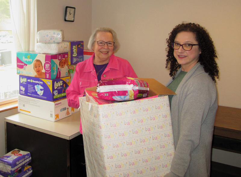 Diaper bank managers Cathy Hopkins and Susan Rockwood prepare for the annual diaper drive.