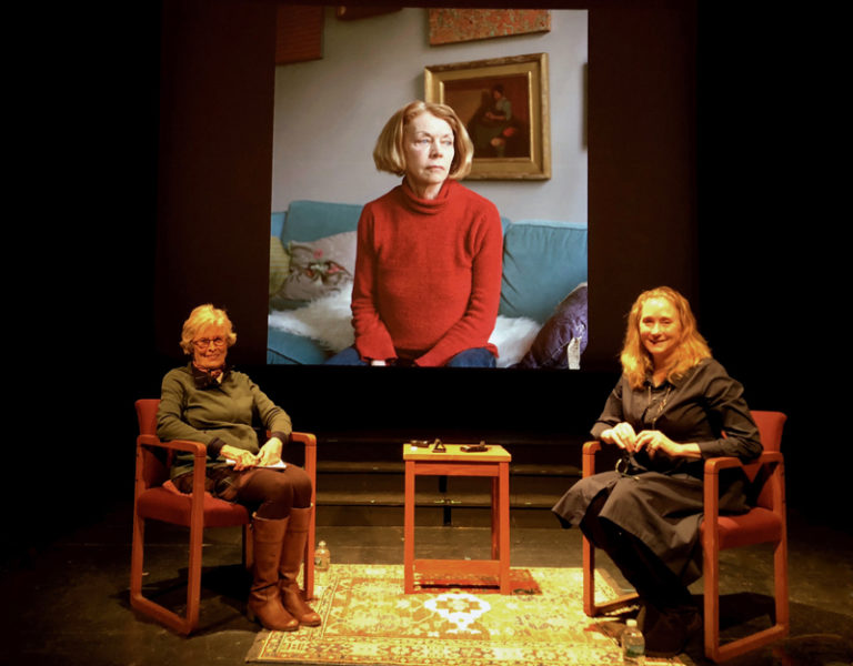 Newcastle artist Jane Dahmen (left) chats with guest artist and photographer Jocelyn Lee on Thursday, May 2 during Dahmen's live interview event at Lincoln Theater in Damariscotta, Talking Art in Maine: Intimate Conversations. Behind Dahmen and Lee is a projection of a piece titled "Bebe," part of Lee's Personal Histories series. (Photo courtesy Lenin Sabino)