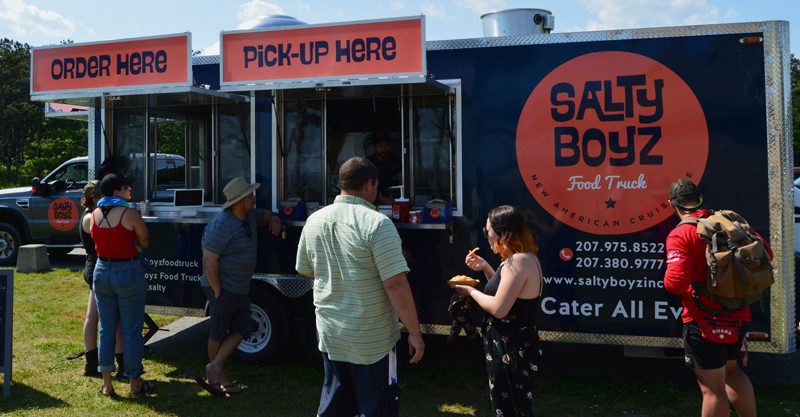 A crowd gathers in front of the Salty Boyz Food Truck at Popham Beach State Park in Phippsburg on Sunday, June 23. The truck will be open at Popham from 9 a.m. to 3 or 4 p.m. every day until Labor Day. (Evan Houk photo)